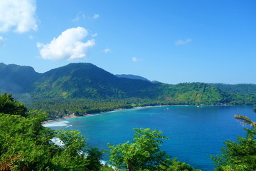 Beautiful landscape of Pantai Nipah, Lombok island scenic travel destination beach with crystal blue waters and coconut trees - near Bali, Indonesia