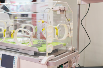 Empty infant incubator in an hospital room. Specially equipped room with newborn babys sleeping in incubators in the Obstetrics and Gynecology Hospital