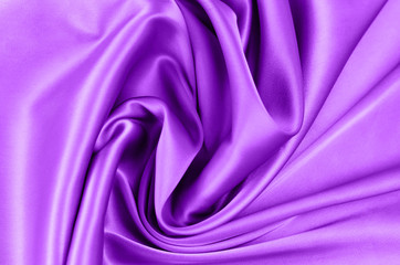 Background from satin fabric of violet color.