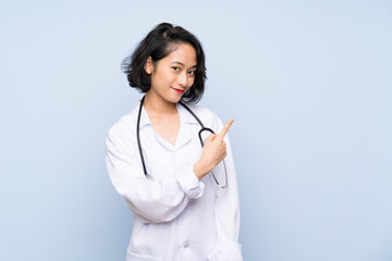 Doctor Asian woman pointing to the side to present a product