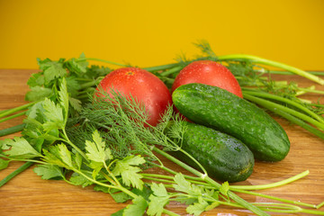 Summer vegetables for salad, tomatoes, cucumbers and herbs
