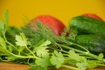 Summer vegetables for salad, tomatoes, cucumbers and herbs