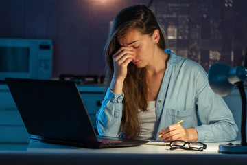 Sad exhausted stressed tired woman feeling fatigue, eye strain from late reading book before exam...