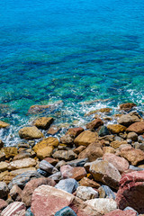 an Aerial view of ocean waves and Rocky coast