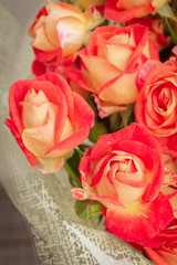 Large beautiful bouquet of orange roses in the package