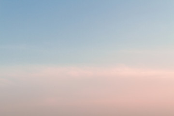 Beautiful sunset sky with feathery pink clouds in spring