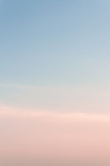Beautiful sunset sky with feathery pink clouds in spring