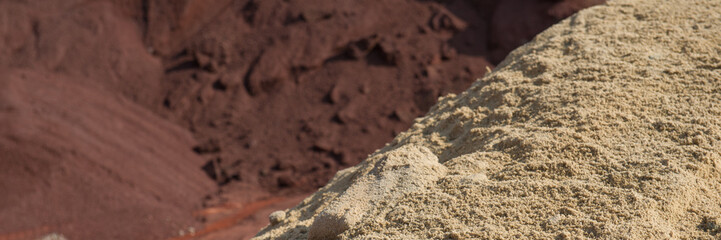 quartz sand and minium in the warehouse of raw materials, cement production.