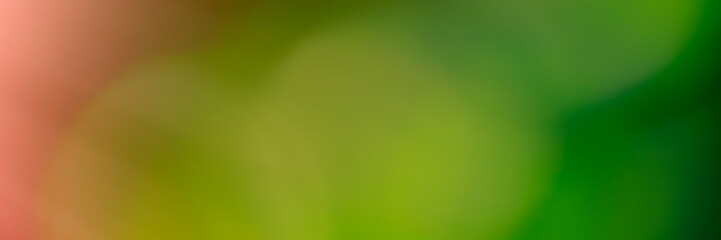 Abstract blurred background, pink, green, yellow.