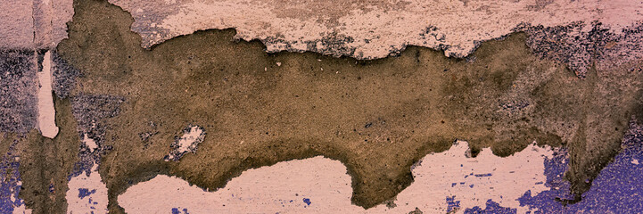wall surface with old painted decaying cement plaster.