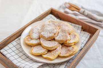 home made sweet vanilla Tasty Pancakes with sugar on a table