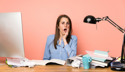 Young student girl surprised and shocked while looking right