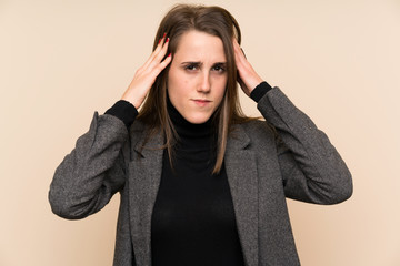 Young woman over isolated wall unhappy and frustrated with something. Negative facial expression