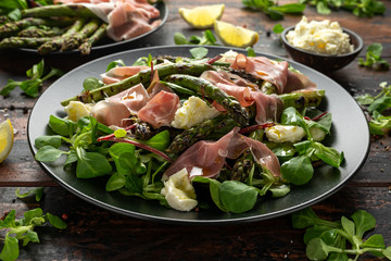 Grilled Asparagus, parma ham salad with mozzarella cheese and green vegetables