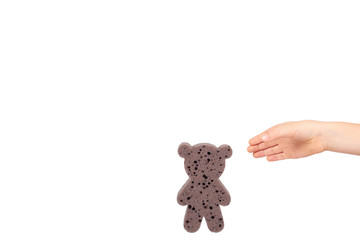 Kids hand with bathroom sponge, soft foam for body care.