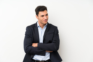 Handsome man over isolated white wall thinking an idea