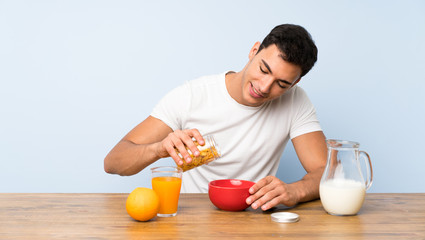 Fototapeta na wymiar Handsome man in having breakfast