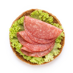 Sandwich with salami sausage on white background.
