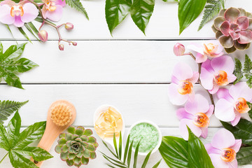 Beauty and fashion concept with spa set on pastel rustic wooden background.