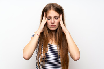 Young woman with long hair over isolated white wall with headache