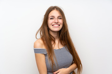 Naklejka premium Young woman with long hair over isolated white wall smiling