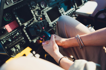 Female pilot in cockpit of helicopter before take off. Young woman helicopter pilot. © Евгений Вершинин
