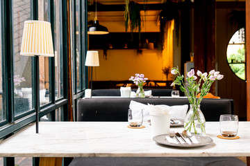 beautiful flower in vase on dinning table