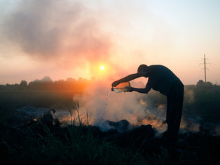Fire in the field. Volunteers fighting the fire