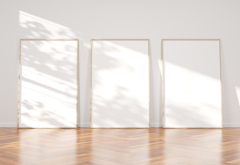 Three wooden frame leaning in wooden interior mockup 3D rendering