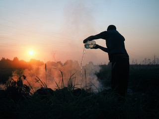 Fire in the field. Volunteers fighting the fire