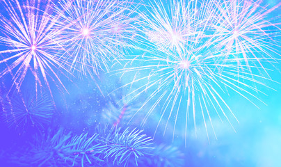 Christmas pine branch on a beautiful blue background with sparks and fireworks splashes, wonderful New Year's mood