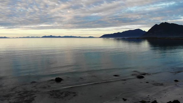 Coast of Gimsoya island, seascape in Gimsoysand in summer, midnight sun. Nordland county, Lofoten archipelago Norway. Tourist attraction