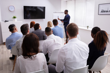Businessman Giving Presentation To His Colleagues