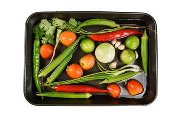 Washing fresh vegetables in the black tray