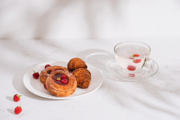 Raspberry filled pastries with sugar sprinkles. Selective focus.