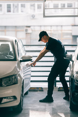 Assaulter breaking a car