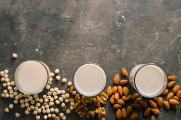 Obraz na płótnie Canvas Glasses of milk: Almond, soy, walnut. Top view.