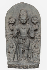Fototapeta na wymiar Archaeological sculpture of Surya, made of Basalt rock. Circa tenth century of the Common Era, Bihar, India