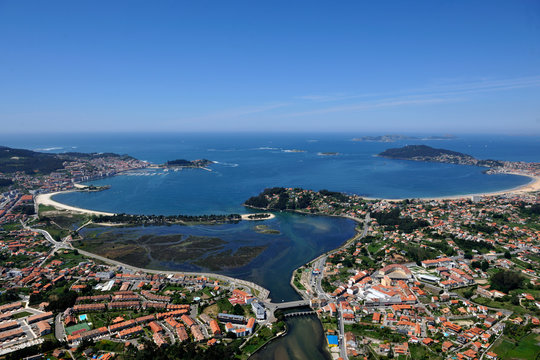  aerial image of the coastal city of baiona in pontevedra, galicia