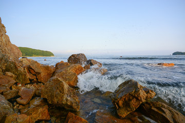 Fototapeta na wymiar Seashore, rocks and waves. Ladnscape
