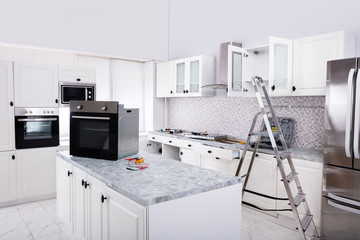 Installation Of Luxurious Oven In The Modular Kitchen
