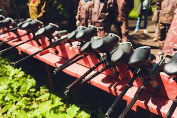 Paintball guns on a wooden table. play paintball.