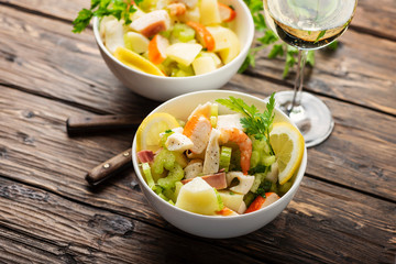 salad with seafood, potato and celery