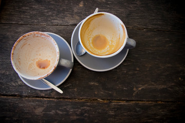 Empty Coffe Cups on saucers with teaspoon