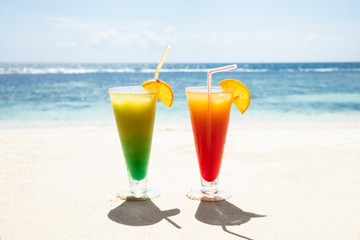Two Glasses Of Cocktails On The Sandy Beach