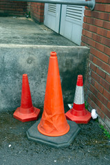 Abandoned Traffic Cones in Urban Back of Shops Setting