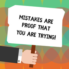 Conceptual hand writing showing Mistakes Are Proof That You Are Trying. Business photo showcasing Trial and error is the way to success Hu analysis Holding Colored Placard with Stick Text Space