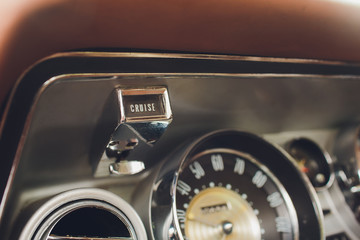 Vintage car dashboard with chrome rims speedometer tachometer. speedometer tachometer