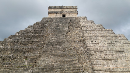 Mayan Pyramid of Chichen Itza on a cloudy day, Mexico