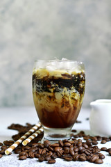 Homemade delicious iced coffee or frappe in a tall glass.